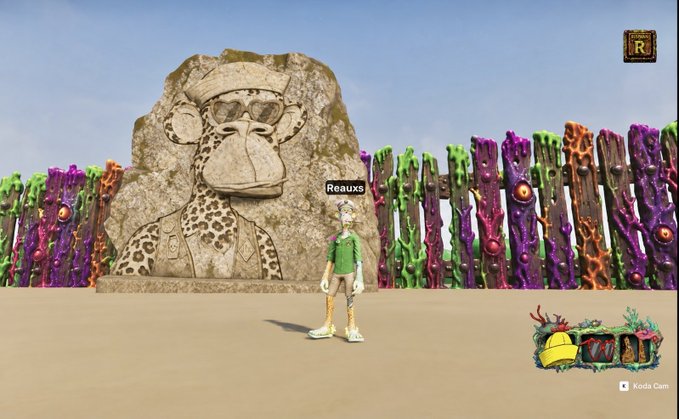 A digital avatar named "Reauxx" stands before a large stone cheetah carving and a colorful spiked fence in a virtual 3D environment, fitting the ODK build party theme celebrating @NGBxShpend's birthday with a "Cheetah Gang" nod to Bored Ape Yacht Club culture.