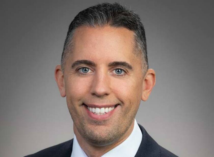 The image features a man wearing a suit and tie with a big smile on his face, looking directly at the camera. The caption reads "$MSTR $ASST Matt Cole = thin-skinned $MSTR $ASST Michael Saylor = Thick-Skinned Founder Saylor welcomes negativity, criticism, and lies from the news, analysts, and accounts". This caption suggests that the man is a successful businessman who has faced challenges due to his thick skin.