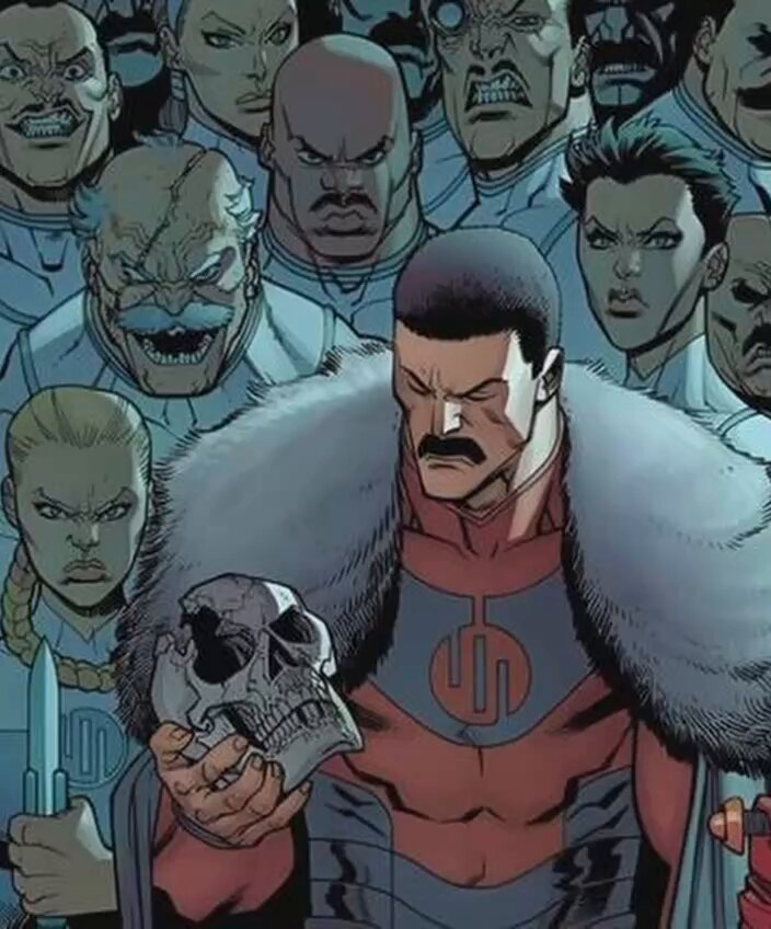 The image features a man dressed as a character from Marvel Comics with a skull and fur coat, holding a skull above his head. The surrounding crowd consists of other characters from the same comic series, creating an atmosphere reminiscent of a convention or comic book event.