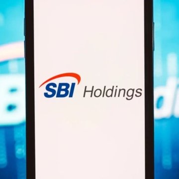 The image displays the SBI Holdings logo on a smartphone screen, with a blue bokeh background. The post announces that SBI Holdings has made an additional investment in UAE-based Fasset at a $1 billion valuation, planning to make it an equity-method affiliate after its Series C funding round.