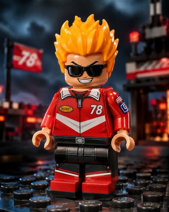 A LEGO minifigure with spiky orange hair, sunglasses, and a red racing jacket with the number 78, posed on a studded baseplate.