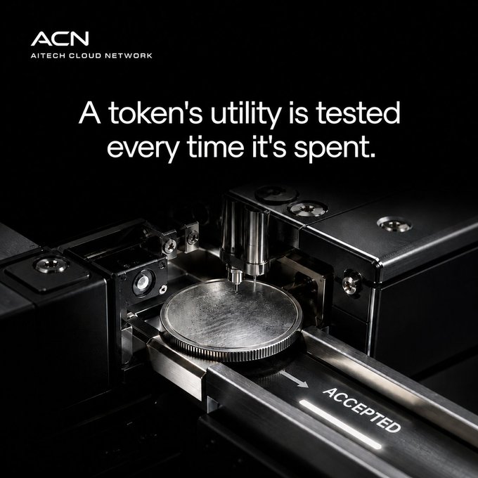 The image shows a close-up of industrial machinery processing a coin on a track labeled "ACCEPTED," with the ACN (AITECH CLOUD NETWORK) logo and the headline "A token's utility is tested every time it's spent."

The imagery of a coin being verified and accepted by the machine visually reinforces the post's message about token utility being proven through real-world use rather than just promised in whitepapers—mirroring how physical currency is only valuable when it's accepted in exchange for goods or services.