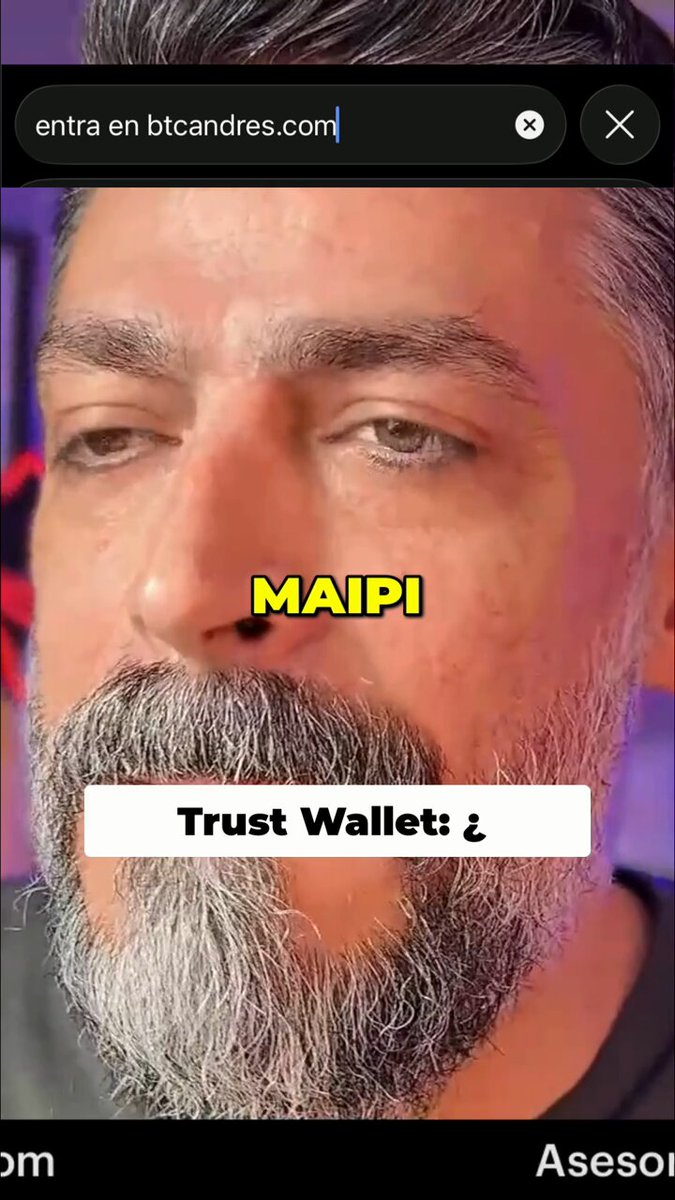 The image shows a man with a beard wearing glasses looking at his phone screen. The text displayed on the screen reads "Trust Wallet: Is it a closed-source piece of garbage backed by Binance? They claim that open source is bad for them, it was hacked and generated millions of private keys". This post seems to be discussing the concept of trust wallets and their relation to Bitcoin.