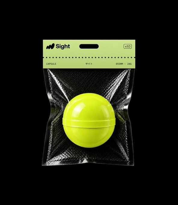 A neon yellow capsule-shaped object is packaged in a clear plastic bag with a neon green header card reading 'Sight', 'CAPSULE', 'サイト', 'Ø55MM', and 'v1.0'.