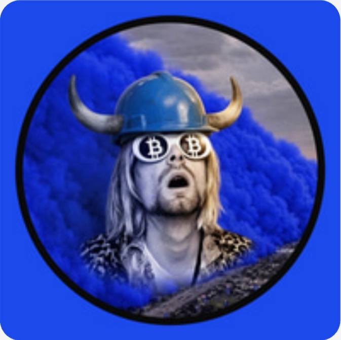 A meme-style illustration of a man wearing a blue hard hat with horns and Bitcoin-symbol glasses, surrounded by blue smoke on a blue background.