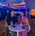 Two people sit at a small table at an evening event near what appears to be a docked cruise ship, likely tied to an Ethereum gathering. The setting reflects the post's focus on Ethereum's community and conversations about its future beyond its first decade.
