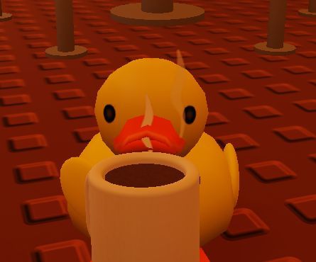 A 3D render of a yellow rubber duck with an angry expression sitting on a red Lego-like base.