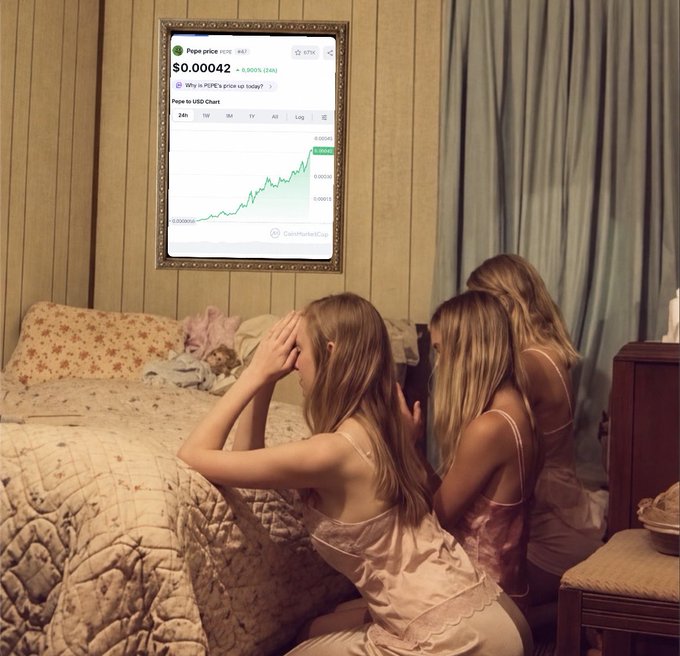 Three young girls in nightgowns kneel on a bed with hands clasped in prayer, gazing up at a framed Pepe coin price chart displaying $0.00042 (PEPE) with a 9.905% gain, humorously conveying the "GM Pray for $PEPE" sentiment as they appeal to the meme coin's upward momentum.