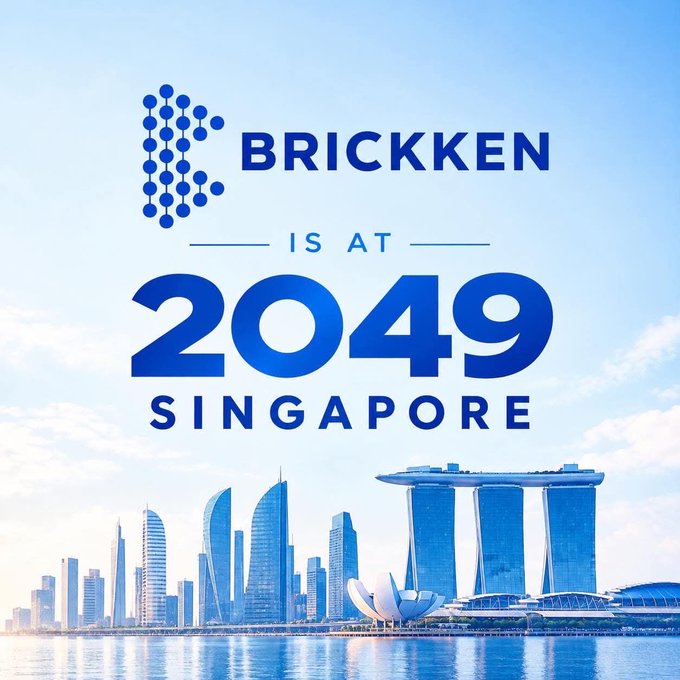 A promotional graphic features the Brickken logo over a blue-tinted Singapore skyline, announcing 'BRICKKEN IS AT 2049 SINGAPORE'.