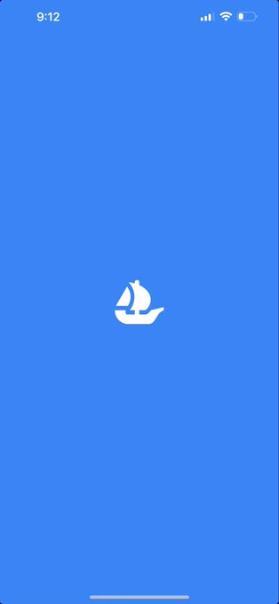 The image features a blue phone screen with an app icon that looks like a small boat sailing through the water, accompanied by a white ship symbol. The background of the image is gray, which contrasts with the blue color of the phone screen. The text on the image reads "@opensea mobile beta! I’m having so much fun! You are all in for a treat!".