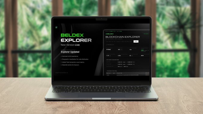 A laptop on a wooden desk displays the 'BELDEX EXPLORER' website announcing a 'New Version Live' with an updated blockchain explorer interface.
