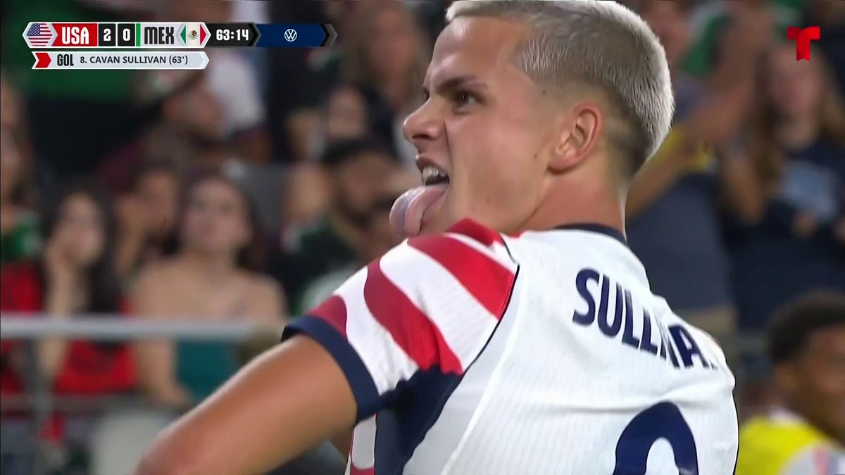 Soccer player Cavan Sullivan celebrating a goal for Team USA in a match against Mexico, with the scoreboard showing USA 2-0 MEX at 63:14.