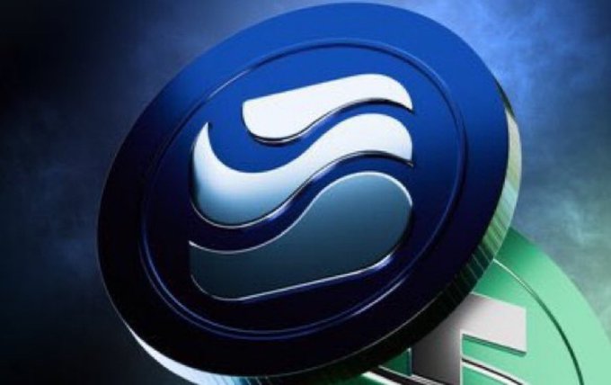 The image features a blue and silver coin with the word "RIVER" written on it. The coin has a unique design that resembles waves or water, giving it an aquatic theme. It appears to be a digital illustration of the coin, which is placed against a dark background. The caption below the image reads: "One thing I’ve noticed lately is that the $RIVER ecosystem feels a lot more focused on utility than short-term excitement". This suggests that the coin's design and features are more about practicality or functionality rather than being purely decorative, as it might be associated with cryptocurrency or digital currency.