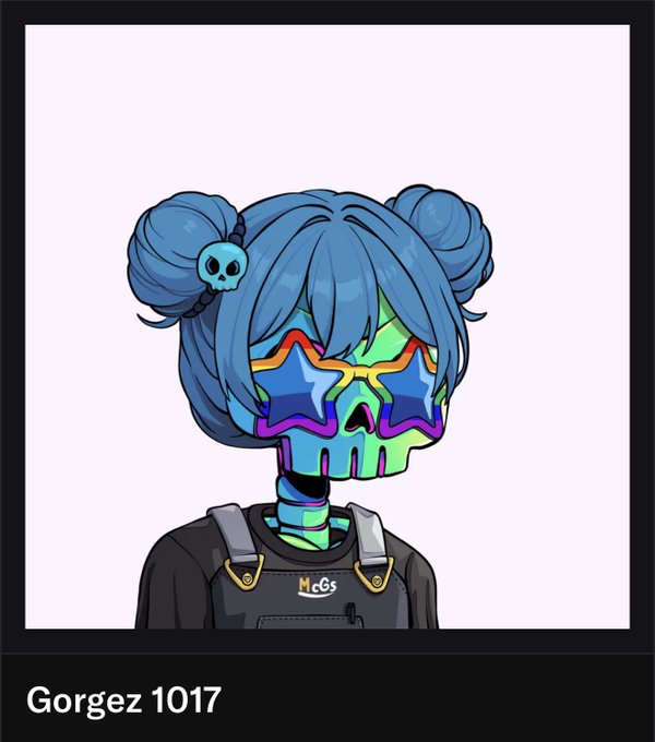An illustration of a blue-haired cartoon character with skull hair clips and rainbow star-shaped sunglasses, labeled 'Gorgez 1017' and wearing overalls with a 'Mc&s' logo.