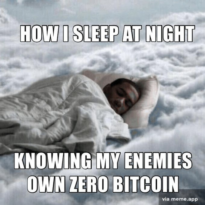 A meme shows a man sleeping peacefully on a cloud with text reading "HOW I SLEEP AT NIGHT KNOWING MY ENEMIES OWN ZERO BITCOIN," watermarked "via meme.app".