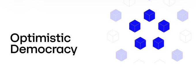 Logo for 'Optimistic Democracy' displayed in black text next to a pattern of blue and light purple 3D cubes.