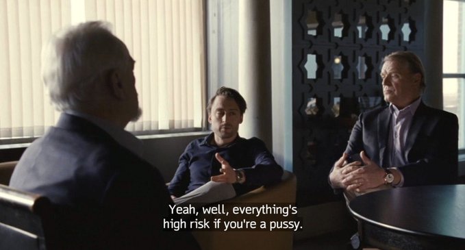 A scene from the TV show 'Succession' showing three older men in suits sitting in a modern office, with one saying the subtitle: 'Yeah, well, everything's high risk if you're a pussy.'