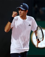 A tennis player wearing a white Adidas shirt and navy cap pumps his fist in celebration while holding a racket, likely after winning a point or match. The image relates to a sports betting post highlighting a wallet that has amassed $163k in profits, with large wagers placed on US Open predictions including $40.6k on Rafael Jodar and $26.8k on Jiri Lehecka.