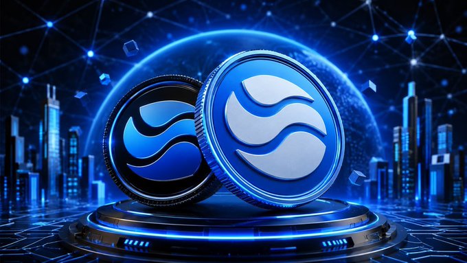A 3D-rendered cryptocurrency graphic features two metallic blue coins with a wave-like logo (resembling Aptos or a similar altcoin) on a glowing circular pedestal, set against a futuristic cityscape with networked blue lights and digital cubes.