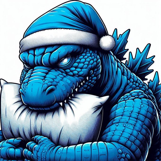 A stylized blue illustration of Godzilla wearing a Santa hat and holding a pillow.