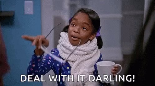 The image features a young girl with black hair wearing a blue dress, holding a cup of coffee and pointing towards something out of frame. The caption below the image reads "Deal With It Darling!".