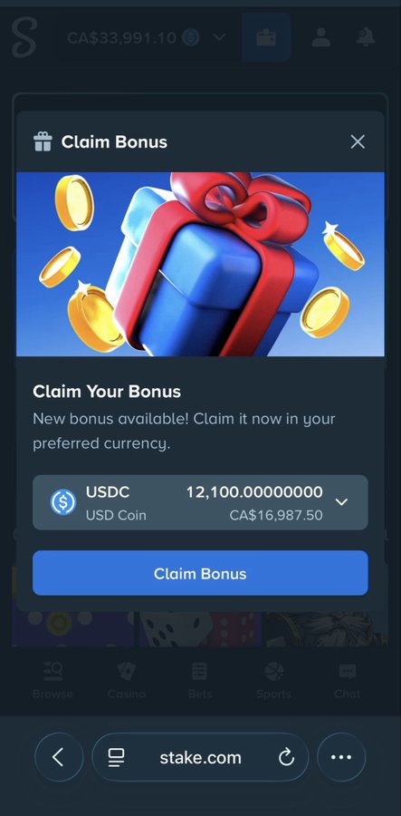 A promotional popup from stake.com offering users the ability to claim a bonus of 12,100.00 USDC (CA$16,987.50) from their CA$33,991.10 account balance, tied to a $50 ETH/USDT/Stake Tip flash giveaway that requires reposting and commenting for entry.

Wait, I need to look more carefully. The bonus shown (12,100 USDC) is significantly larger than the $50 giveaway mentioned in the post. Let me reconsider.

A Stake.us promotional screen displays a "Claim Bonus" popup offering 12,100 USDC (equivalent to CA$16,987.50), tied to a $50 Flash Giveaway promotion running for 12 hours that requires users to reply and repost for a chance to win prizes paid in ETH, USDT, or a Stake Tip.