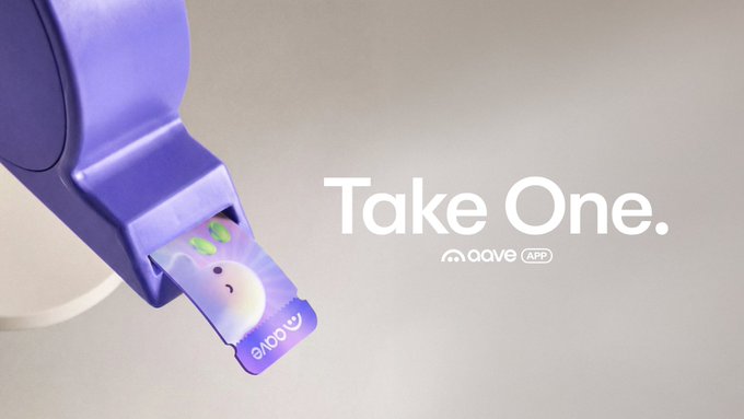 The image shows a purple lanyard-style tag or device with a cute ghost character design, alongside the text "Take One." and the "aave APP" logo. It visually represents the "Ghost Pass" mentioned in the post, advertising the opportunity to use the code "TAKEONE" for instant access to the Aave App.