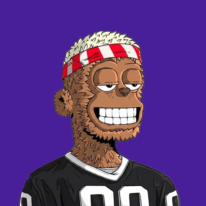 A cartoon illustration of a furry brown monkey-like character with a wide toothy grin, wearing a red and white striped headband and a black sports jersey against a purple background.