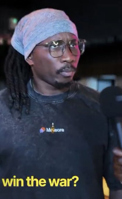 A man with dreadlocks, a grey beanie, and glasses wearing a black 'Molecota' sweatshirt, with yellow text 'win the war?' overlaid at the bottom.