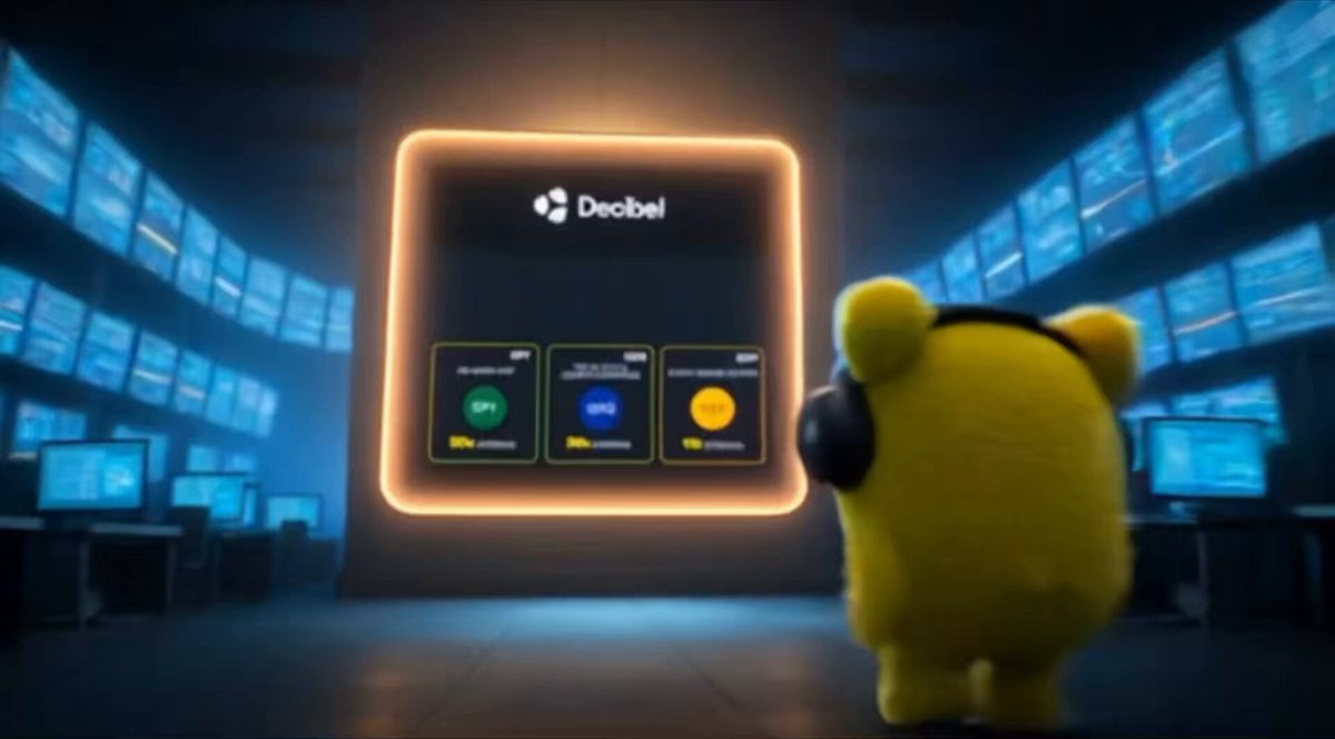 The image features a small yellow toy teddy bear, possibly a plush animal or figurine, positioned near a screen that is lit up with a bright orange glow. The bear appears to be looking at something on the screen or at another object. In the background, there are several other screens of varying sizes located around the teddy bear's position. 

The image has been described as being related to DecibelTrade Index ETF Perps and the company Debel. This suggests that it may be a promotional image for an ETF fund, specifically one associated with the index tracking the S&P 500 or another popular market index.