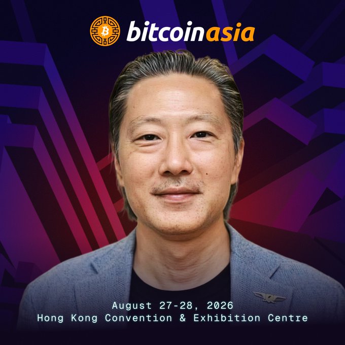 A promotional image for Bitcoin Asia 2026 features a headshot of an Asian man with short dark hair wearing a gray blazer over a black shirt, set against a purple geometric background with the Bitcoin Asia logo at the top. Text at the bottom reads "August 27-28, 2026, Hong Kong Convention & Exhibition Centre," confirming the event details mentioned in the post about Bitstamp by Robinhood President Leonard Hoh speaking at the conference.