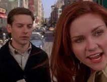 Kirsten Dunst and Tobey Maguire appear in a scene from Spider-Man, with Dunst's expression conveying confusion or discomfort while looking back at Maguire. The image humorously illustrates the post's joke about a character being "derived from insufficient dice rolls," as Dunst's skeptical look suggests she's reacting to someone whose poor judgment or character stats were determined by bad luck.