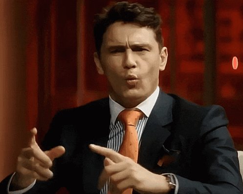 The image features a man wearing a suit, tie, and cufflinks, with his hands pointing towards each other as if he's making a gesture or giving instructions. The background of the image has red walls, which adds a bold color contrast to the scene. The caption below the image reads "Wall Street legends: 'We like Ethereum! It’s the future of finance. ETH is one of the most important assets of our time!'" This suggests that the man in the suit might be referencing famous figures or trends related to cryptocurrency and blockchain technology, which are often associated with Wall Street culture.
