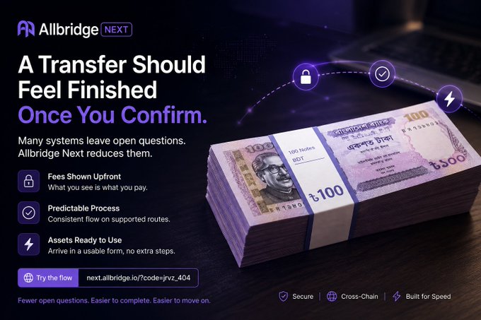 The image is a promotional graphic for "Allbridge NEXT," featuring a stack of Indian 100 rupee banknotes alongside three key feature callouts—transparent upfront fees, a predictable process, and assets ready to use—with a link "next.allbridge.io/?code=jvz_404." It visually reinforces the post's message by depicting currency in a usable form (bundled banknotes rather than abstract tokens), symbolizing the platform's promise that cross-chain transfers arrive complete and ready without extra steps or uncertainty after confirmation.