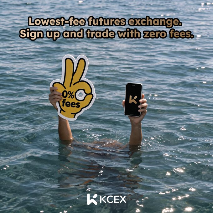 An advertisement for KCEX featuring a person submerged in water holding a '0% fees' sign and a smartphone, with text reading 'Lowest-fee futures exchange. Sign up and trade with zero fees.'