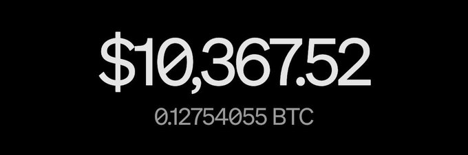 A black screen displays white text reading '$10,367.52' and '0.12754055 BTC'.