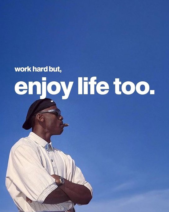 A man in a white shirt and black cap smoking a cigar against a clear blue sky, with the text 'work hard but, enjoy life too.'