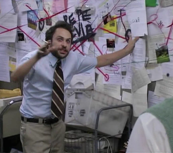 Charlie Day's character from It's Always Sunny in Philadelphia in the famous 'Pepe Silvia' conspiracy board scene, surrounded by papers connected by red string with 'PEPE SILVIA' written on the wall.