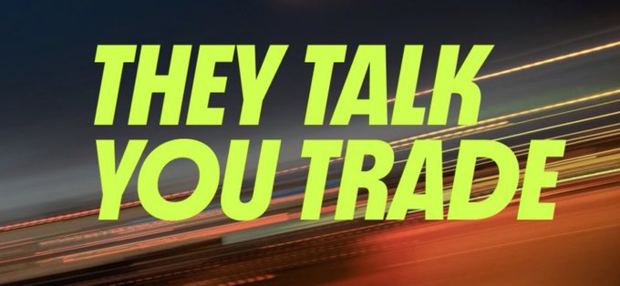 A bold neon green and yellow headline reads "THEY TALK YOU TRADE" over a streaking, motion-blurred background of city lights in red and orange tones, conveying urgency and speed. The image visually reinforces the post's warning about hype and distraction, while highlighting @trylimitlessfin as a project worth paying attention to amid the noise.