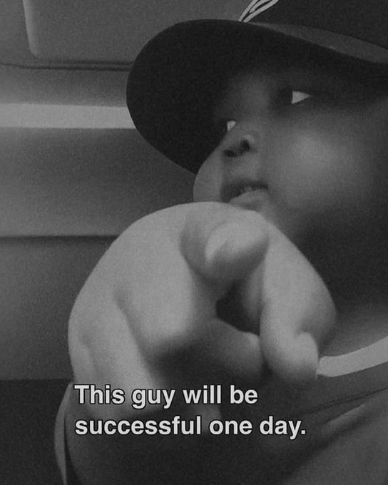A black and white meme featuring a baby in a baseball cap pointing at the camera with the caption 'This guy will be successful one day.'