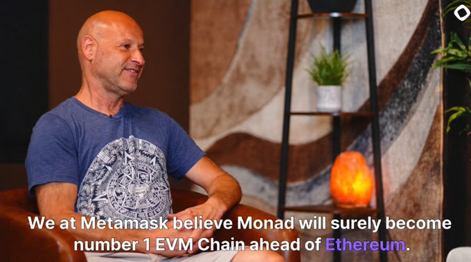 A man speaks in a studio setting with a quote reading: 'We at Metamask believe Monad will surely become number 1 EVM Chain ahead of Ethereum.'