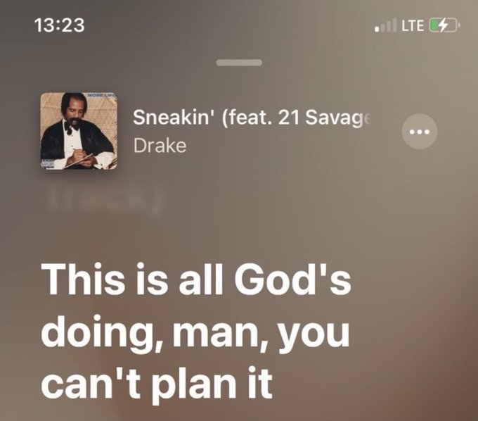 An iPhone lock screen screenshot displaying a Spotify widget playing Drake's 'Sneakin'' (feat. 21 Savage) with lyrics shown: 'This is all God's doing, man, you can't plan it' at 13:23.