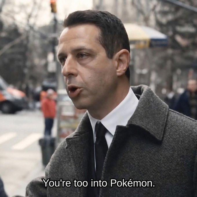 iced coffee and a traffic light are visible on the sidewalk, with a man in a gray suit jacket and tie standing nearby.