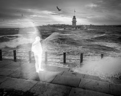 A ghostly, semi-transparent figure of a person stands on a seawall beside a railing, with a lighthouse in the distance and crashing waves under a moody sky, evoking themes of transience and impermanence. The accompanying post about "TransientLabs" plays on the word "transient," mirroring the fleeting, spectral nature of the figure in the image.