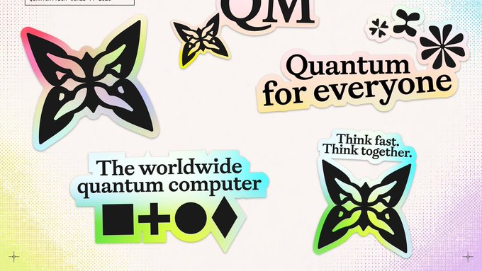 A colorful, sticker-style graphic promoting 'Quantum' with various text elements including 'QM', 'Quantum for everyone', 'Think fast. Think together.', and 'The worldwide quantum computer', decorated with butterfly and flower motifs.