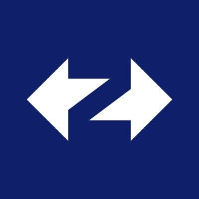 A blue sign with two white arrows pointing in opposite directions, symbolizing indecision or a crossroads. The image reflects the poster's uncertainty and frustration about $ZKsync's shifting focus away from the $ZK token, highlighting their dilemma as a loyal supporter caught between continuing to back the project and questioning its direction.