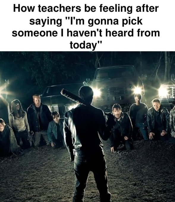 A meme featuring the text 'How teachers be feeling after saying "I'm gonna pick someone I haven't heard from today"' over an image from a horror movie showing a man holding a weapon facing a group of menacing people in a dark forest.