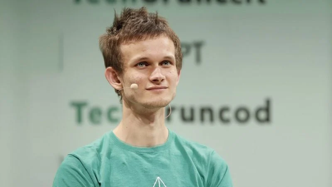 A young man with short brown hair wearing a green t-shirt and a headset microphone speaks at a conference, with 'TechCrunch' visible in the background.