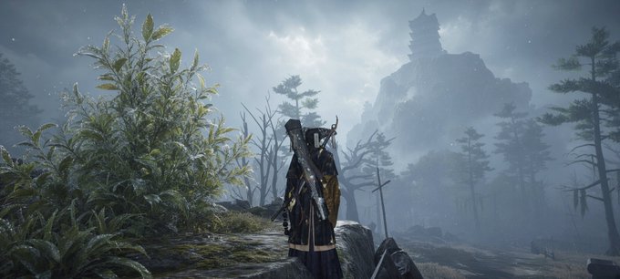 A video game screenshot, likely from Ghost of Tsushima, showing a lone samurai warrior standing on a cliff overlooking a misty, mountainous landscape with a pagoda in the distance.