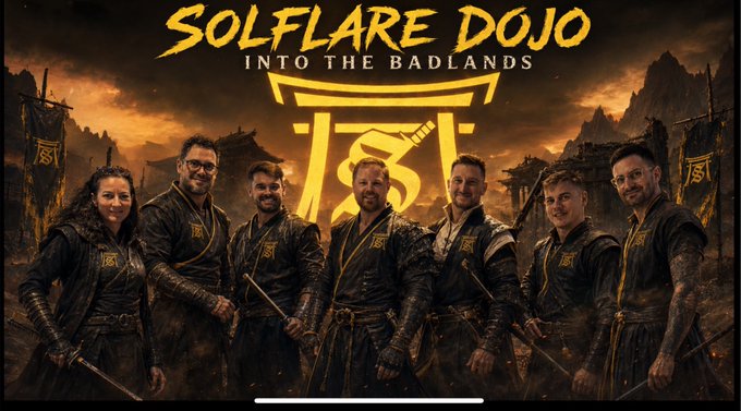 A promotional image titled 'SOLFLARE DOJO INTO THE BADLANDS' featuring seven people dressed in martial arts attire against a fiery, apocalyptic backdrop.